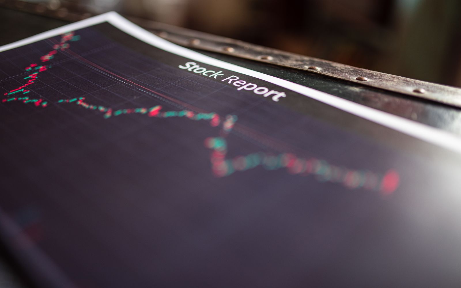 Detailed stock report showing market trends on paper charts. Detailed stock report showing market trends on paper charts.