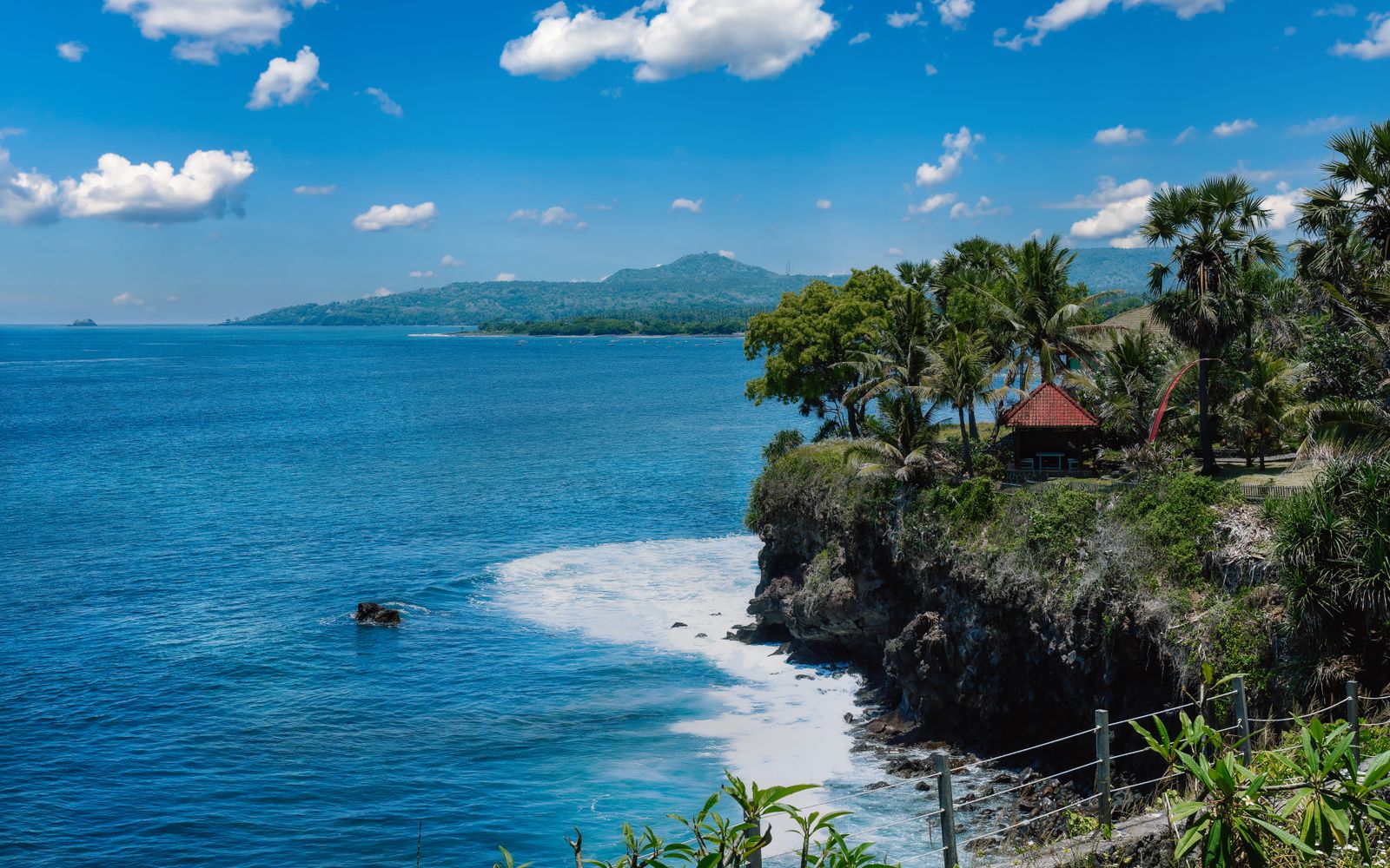 Traditional Balinese villa with thatched roof and private pool