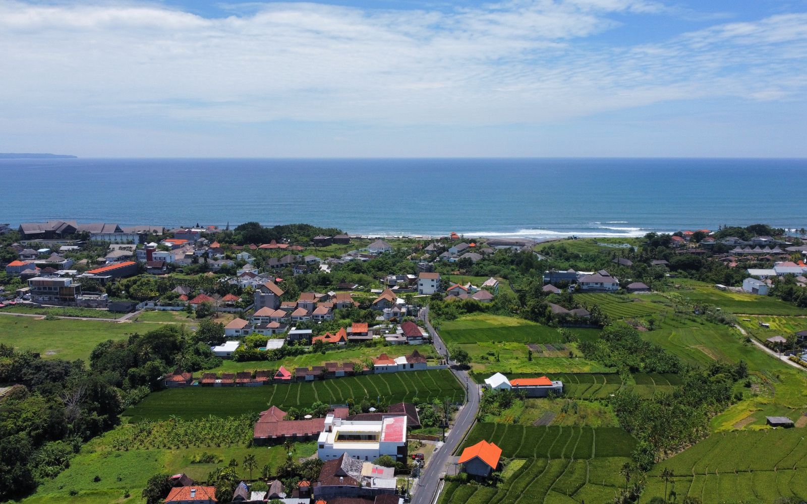 Professional real estate agent discussing property documents with foreign buyers in Bali