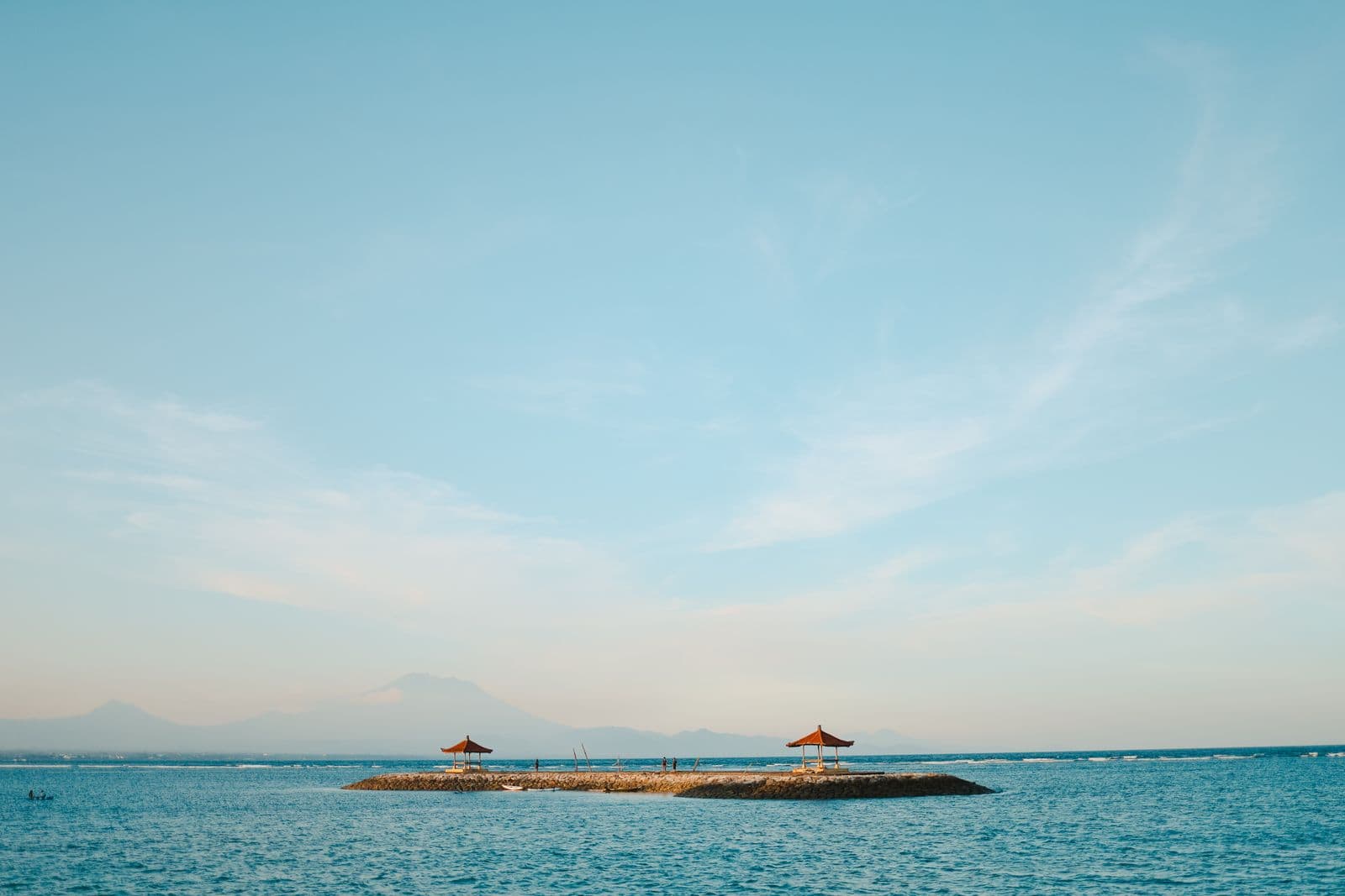 Small island in turquoise sea near Bali